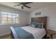 Cozy bedroom with a large window and a classic wooden headboard at 294 Willowick Cir, Highlands Ranch, CO 80129