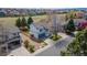 Exterior view of a two-story home with an attached garage, and a well-manicured lawn at 294 Willowick Cir, Highlands Ranch, CO 80129