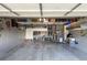 Spacious garage with overhead storage and built-in cabinets, providing ample space for organization and parking at 294 Willowick Cir, Highlands Ranch, CO 80129