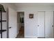 Bright hallway featuring wood floors, white trim, and a view into other rooms at 294 Willowick Cir, Highlands Ranch, CO 80129