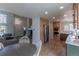Open floor plan showcasing living room and kitchen featuring modern stainless steel appliances and hardwood floors at 294 Willowick Cir, Highlands Ranch, CO 80129