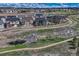Aerial perspective showcases the home's location, surrounded by lush greenery and scenic walking paths at 5251 Silver Hare Ct, Castle Rock, CO 80104