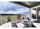 Balcony with seating, wood railing, and neighborhood views at 5251 Silver Hare Ct, Castle Rock, CO 80104