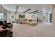 Open basement with sectional, game table and a dart board for entertainment at 5251 Silver Hare Ct, Castle Rock, CO 80104