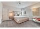 Bedroom with large bed, pendant lights, soft carpet and decor at 5251 Silver Hare Ct, Castle Rock, CO 80104