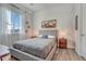 Bedroom with wood floors, and decorative wall art over the bed, with bedside tables and lighting at 5251 Silver Hare Ct, Castle Rock, CO 80104