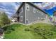 Back exterior view showcasing a well-maintained yard and private patio area at 5251 Silver Hare Ct, Castle Rock, CO 80104