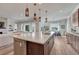 Spacious kitchen island perfect for entertaining with views to the living and dining areas at 5251 Silver Hare Ct, Castle Rock, CO 80104