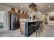 Basement kitchenette with bar seating and modern appliances, ideal for entertaining at 5251 Silver Hare Ct, Castle Rock, CO 80104
