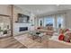 Comfortable living room featuring a stone fireplace and an oversized tv at 5251 Silver Hare Ct, Castle Rock, CO 80104