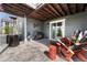 Covered patio featuring an outdoor kitchen, heater, and ski-themed decor, perfect for entertaining at 5251 Silver Hare Ct, Castle Rock, CO 80104