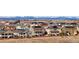 Scenic aerial view of a residential neighborhood with houses, solar panels, and mountain views in the background at 10055 Fort Worth Ct, Parker, CO 80134