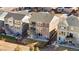 Aerial shot of the house showcasing the backyard, patio furniture, trampoline, and surrounding neighborhood at 10055 Fort Worth Ct, Parker, CO 80134