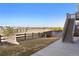 Expansive backyard with a wood fence, grass, a stairwell, and a view of the surrounding community at 10055 Fort Worth Ct, Parker, CO 80134
