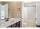Bright bathroom featuring a shower with tub and vanity with white countertop at 10055 Fort Worth Ct, Parker, CO 80134