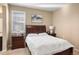 Bedroom featuring a large bed with white bedding and bedside tables with lamps at 10055 Fort Worth Ct, Parker, CO 80134