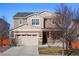 Charming two-story home with a two-car garage and welcoming front porch at 10055 Fort Worth Ct, Parker, CO 80134