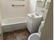 Bathroom featuring tiled shower and tub with a white vanity at 3054 Victor St, Aurora, CO 80011