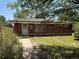 Charming brick home featuring a well-maintained lawn and inviting front entrance at 3054 Victor St, Aurora, CO 80011