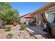 Patio includes a hot tub, an outdoor seating area and a charming rock and brick landscape design at 5471 Ensenada Ct, Denver, CO 80249