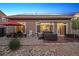 Enjoy the serene backyard with a hot tub, patio, and vibrant landscaping, perfect for relaxation at 5471 Ensenada Ct, Denver, CO 80249