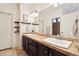 Bathroom features double sinks, tile flooring, and decorative shelving at 5471 Ensenada Ct, Denver, CO 80249