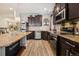 Stylish kitchen featuring stainless steel appliances and a granite countertop island at 5471 Ensenada Ct, Denver, CO 80249