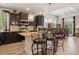 Gourmet kitchen featuring a granite island, stainless steel appliances, and stylish pendant lighting at 5471 Ensenada Ct, Denver, CO 80249