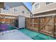 Backyard featuring a wood fence and exterior storage unit at 14700 E 104Th Ave # 1105, Commerce City, CO 80022