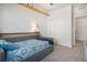 Bedroom with a full-sized closet and blue accents at 14700 E 104Th Ave # 1105, Commerce City, CO 80022