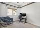 Carpeted bedroom featuring exposed beams and modern work space at 14700 E 104Th Ave # 1105, Commerce City, CO 80022