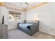 Carpeted bedroom with blue accents and exposed ceiling beams at 14700 E 104Th Ave # 1105, Commerce City, CO 80022