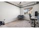 Neutral bedroom featuring carpet floors, exposed beams, and a comfortable seating area at 14700 E 104Th Ave # 1105, Commerce City, CO 80022