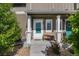 Charming front porch with cozy bench seating, perfect for enjoying a morning coffee at 14700 E 104Th Ave # 1105, Commerce City, CO 80022