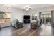 Bright living room featuring hardwood floors, large windows, and an open layout for entertaining at 14700 E 104Th Ave # 1105, Commerce City, CO 80022