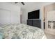 Well-lit bedroom with a ceiling fan, storage closet and an adjacent bathroom at 14700 E 104Th Ave # 1105, Commerce City, CO 80022