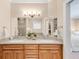 This bathroom features double sinks with wood cabinets and granite counters and a glass enclosed shower at 1824 Pearl St # B, Boulder, CO 80302