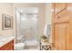 Modern bathroom featuring a glass shower with tiled walls and a built-in bench for a spa-like experience at 1824 Pearl St # B, Boulder, CO 80302