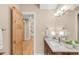 Bathroom with marble countertop and wood cabinetry creating sense of warmth and luxury at 1824 Pearl St # B, Boulder, CO 80302