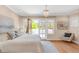 Bedroom featuring hardwood floors, French doors, and a modern chandelier at 1824 Pearl St # B, Boulder, CO 80302
