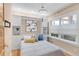 Comfortable bedroom featuring a Murphy bed, bright window, and modern chandelier with neutral color palette at 1824 Pearl St # B, Boulder, CO 80302