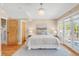 Bright bedroom with French doors, modern lighting, and hardwood floors at 1824 Pearl St # B, Boulder, CO 80302