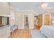 Bedroom featuring modern fireplace, hardwood floors, and neutral color palette at 1824 Pearl St # B, Boulder, CO 80302