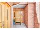 Inviting front door with brick facade, sidelights, and a welcome mat, creating a warm entrance at 1824 Pearl St # B, Boulder, CO 80302