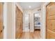 Hallway with wood doors leading to bedroom and bathroom creating sense of depth at 1824 Pearl St # B, Boulder, CO 80302