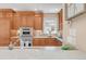 Chef's kitchen featuring high-end stainless steel appliances and custom cabinetry with designer countertops at 1824 Pearl St # B, Boulder, CO 80302