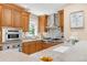 Gourmet kitchen with stainless steel appliances, including a built-in oven and cooktop, and plenty of counter space at 1824 Pearl St # B, Boulder, CO 80302