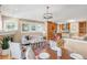 Open living space with a cozy fireplace, stylish furnishings, and a gourmet kitchen in the background at 1824 Pearl St # B, Boulder, CO 80302
