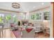 Bright and airy living room featuring a cozy fireplace, neutral decor, and large windows for natural light at 1824 Pearl St # B, Boulder, CO 80302