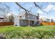 Well-maintained home backyard featuring a covered patio, spacious green grass, and privacy fence at 12945 E Colorado Ave, Aurora, CO 80012